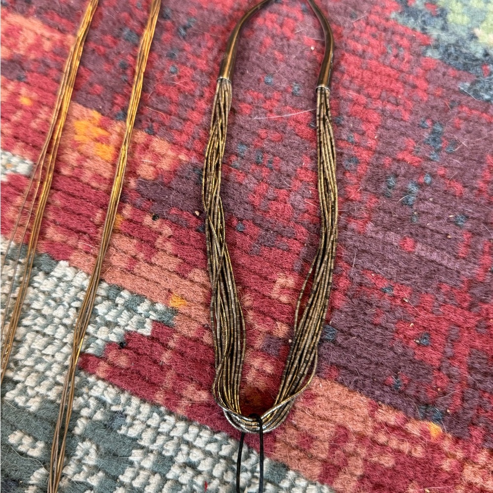 Two liquid silver necklaces